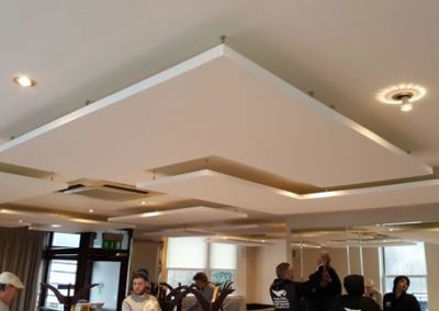 Acoustic ceiling rafts in restaurant
